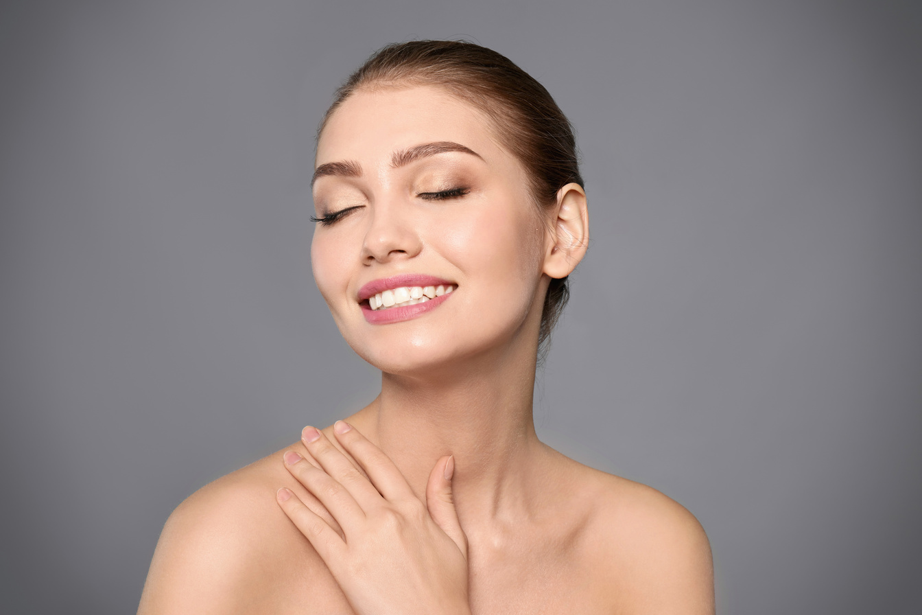 Portrait of Beautiful Young Woman with Clear Skin